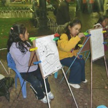 Girls painting on the main square of Cochabamba